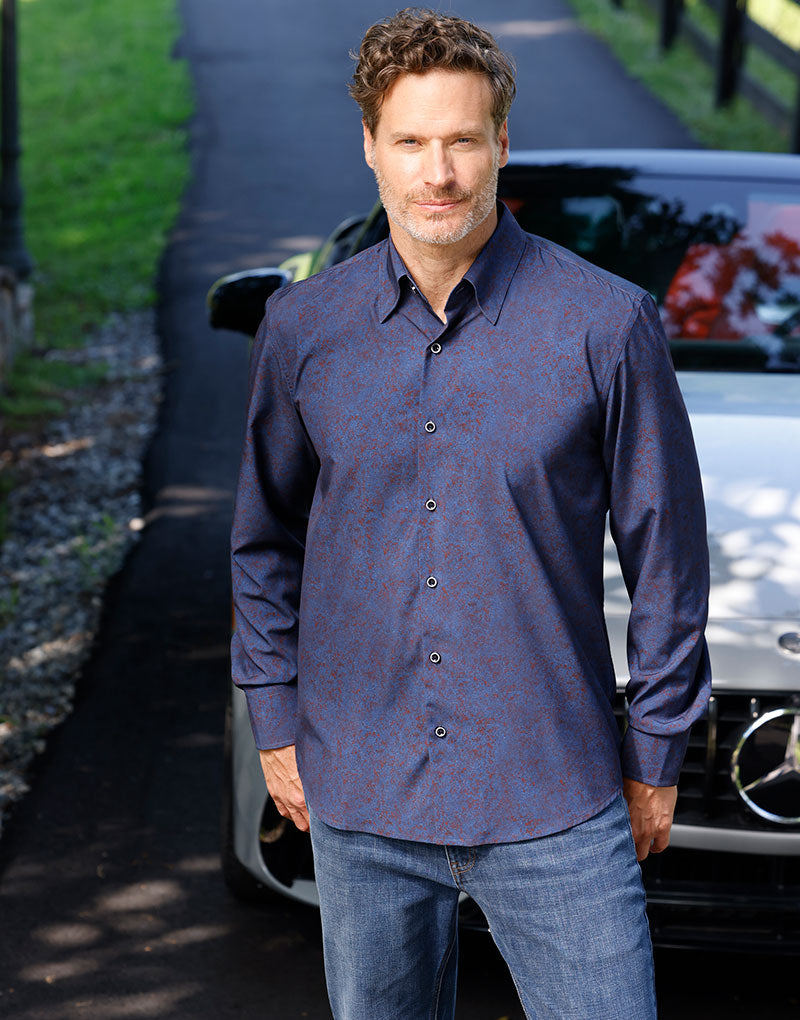 Male model wearing Westport No-Tuck Long Sleeve Button-Under Spread Collar Stretch Performance Medallion Print Sport Shirt