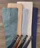 Assorted color options of performance pants, folded side by side
