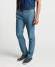 Raleigh performance pant on model in teal-blue, zip fly, side pockets, belt loops