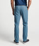 Light blue flat-front performance pant with belt loops and side pockets