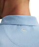 Sailor blue geo-print mesh polo upper back detail with collar and center logo patch.
