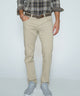 Light khaki stretch denim jeans with belt loops, button fly, and five-pocket design.