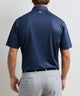 Navy short-sleeve performance polo with patterned print, back view
