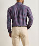 Men's blue plaid performance flannel shirt, back view with long sleeves