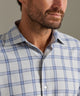 Men's performance flannel shirt collar in light grey with blue plaid, buttoned placket.