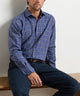 Men's long-sleeve performance flannel shirt in navy-blue plaid, button-front.