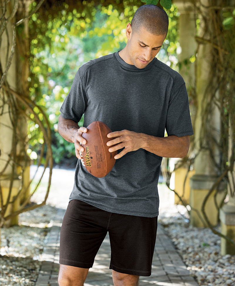 Male model wearing Westport Sport Bamboo Blend Performance Short Sleeve T-Shirt and Shorts