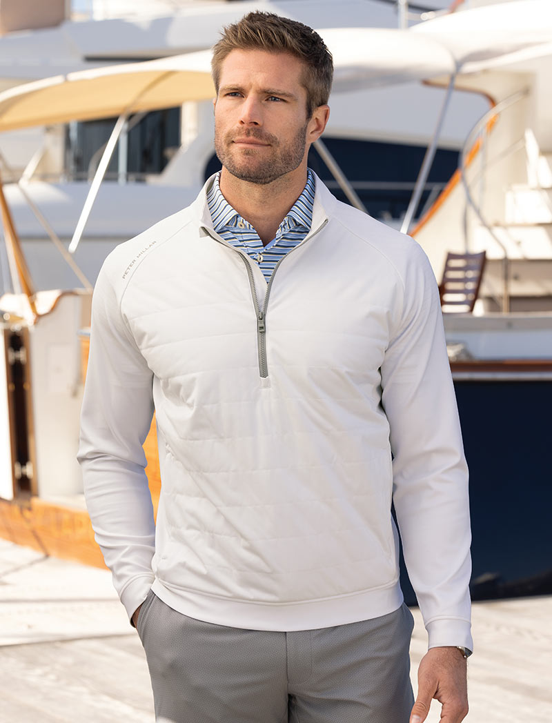Male model wearing Peter Millar Weld Hybrid Half Zip Pullover