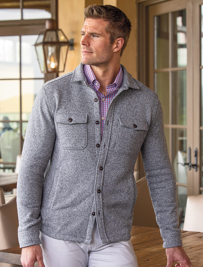male model wearing a sweater vest and sport shirt
